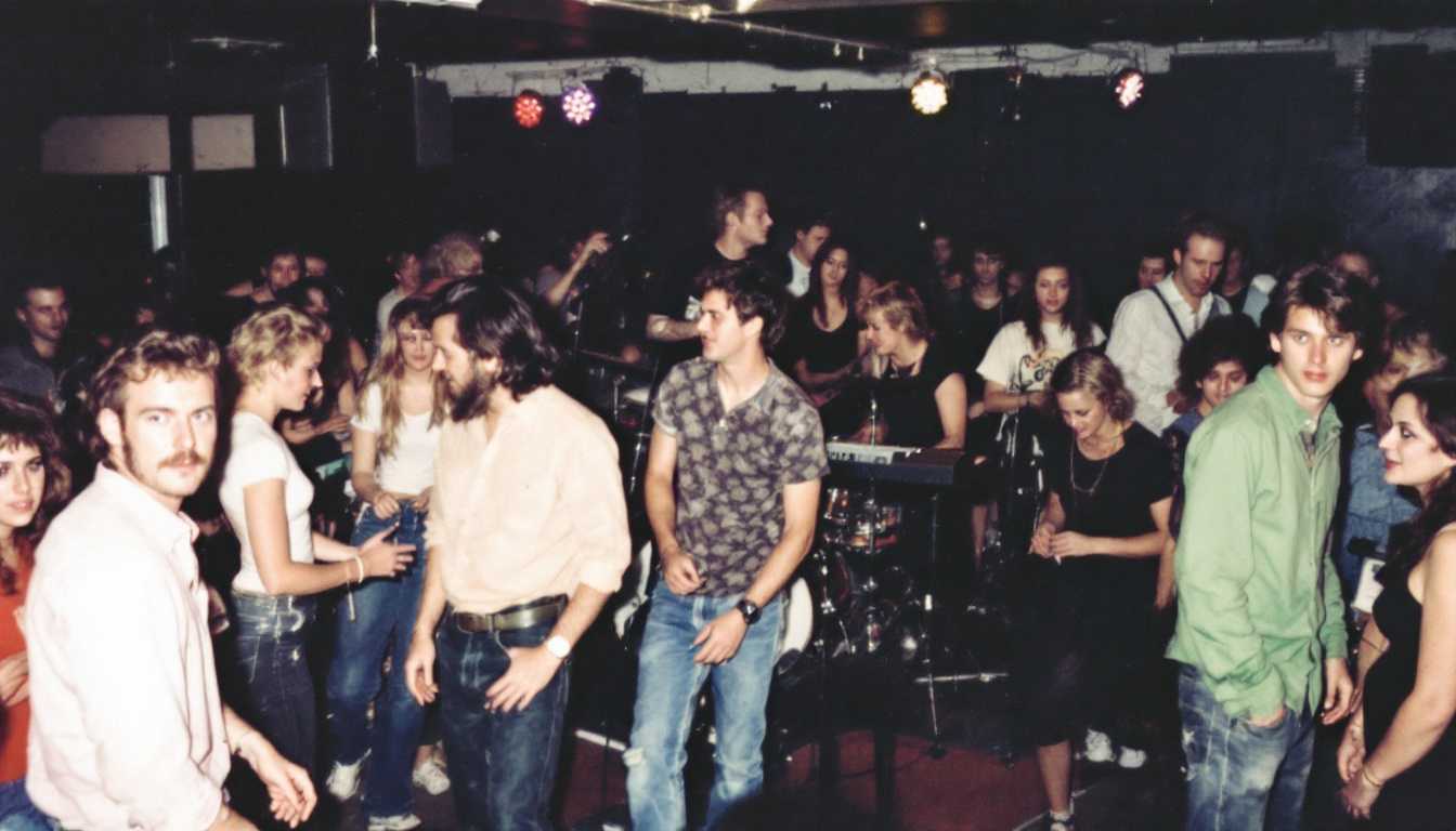 Lively Party Scene with Crowd of People Dancing and Socializing