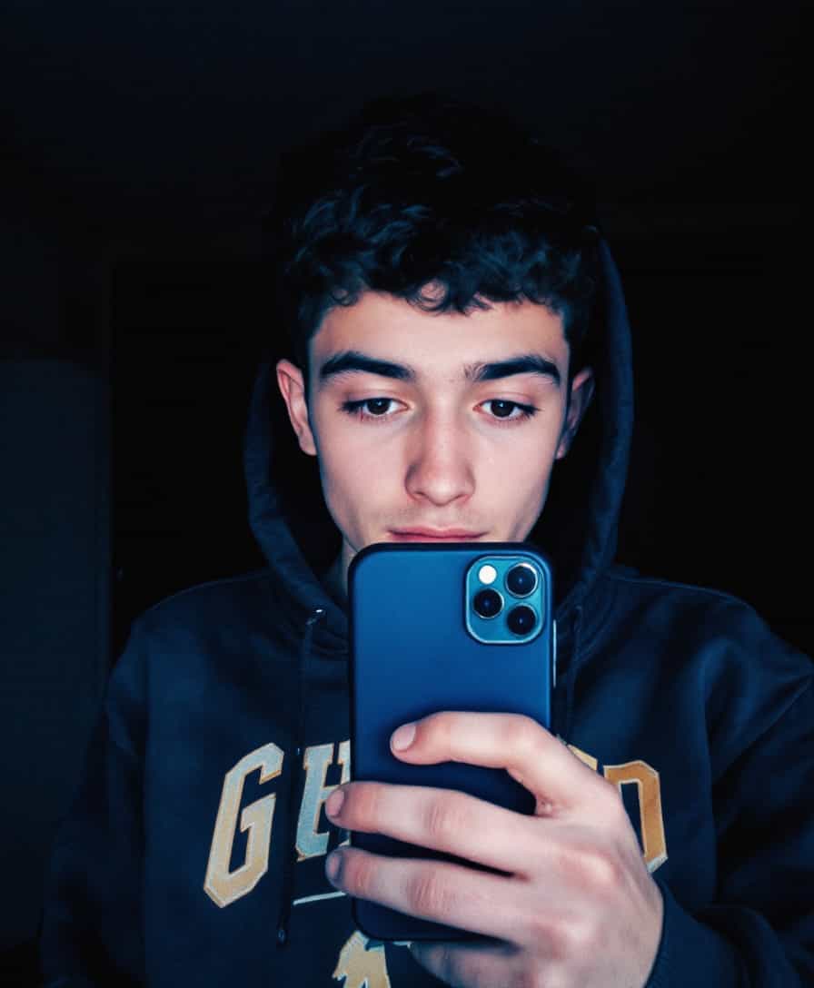 low quality phone photo, snapchat, grainy, male teenage taking morning selfie