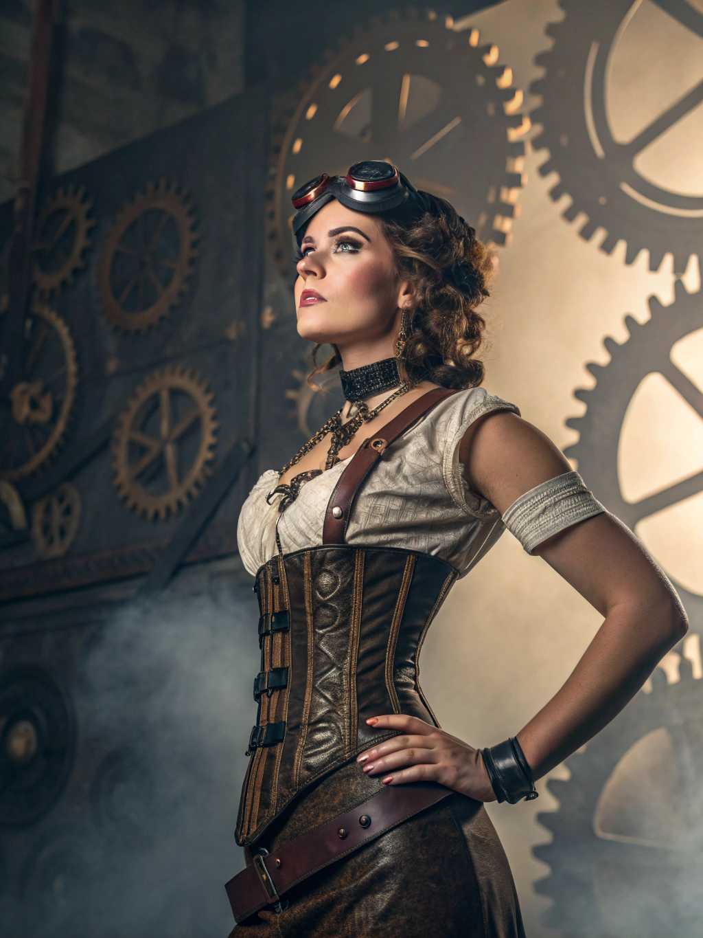 A highly detailed portrait of a confident and alluring woman in a steampunk style. She stands poised against a backdrop of intricate clockwork gears and a smoky, industrial environment. Her attire is an elaborate fusion of Victorian fashion and mechanical elements, featuring a corset adorned with brass cogs and leather straps. Her skin glows under warm, ambient lighting that creates dramatic shadows, enhancing the rich textures of her clothing. The scene is captured in the style of high-definition digital art, emphasizing the metallic sheen and leather grain. Her confident expression is framed by a cascade of wavy chestnut hair, with a pair of steampunk goggles resting atop her head. The composition centers on her upper body, slightly angled to showcase the complexity of her outfit, encapsulating a sense of bold femininity and mystery. The overall mood is adventurous and enigmatic, with a subtle hint of vintage allure.