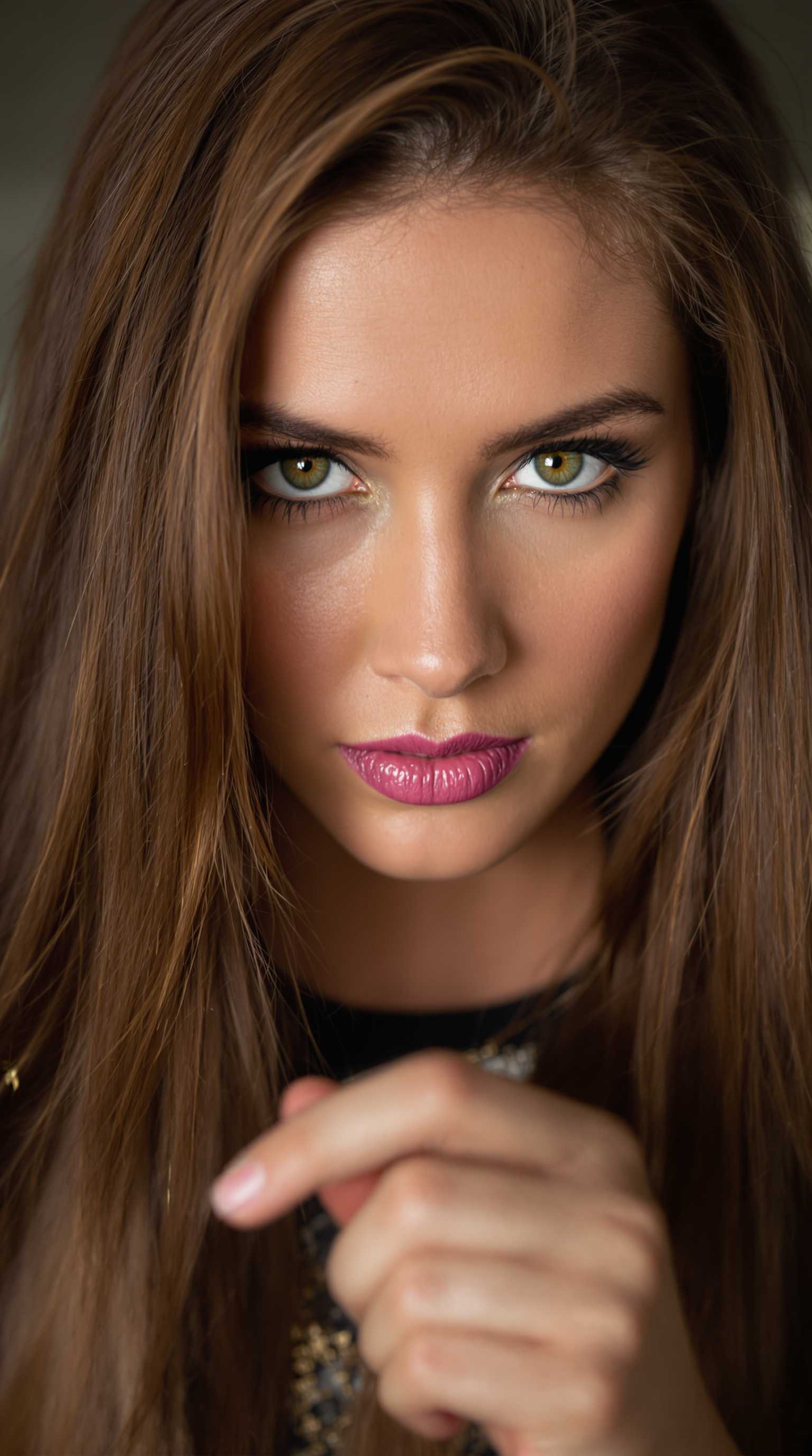 portrait, close up of a In this stunning portrait, a woman with long brown hair and bright green eyes gazes intently at the viewer. Her expression is one of intense concentration as she holds onto her hand in front of her. aidmaRealisticPeoplePhotograph
