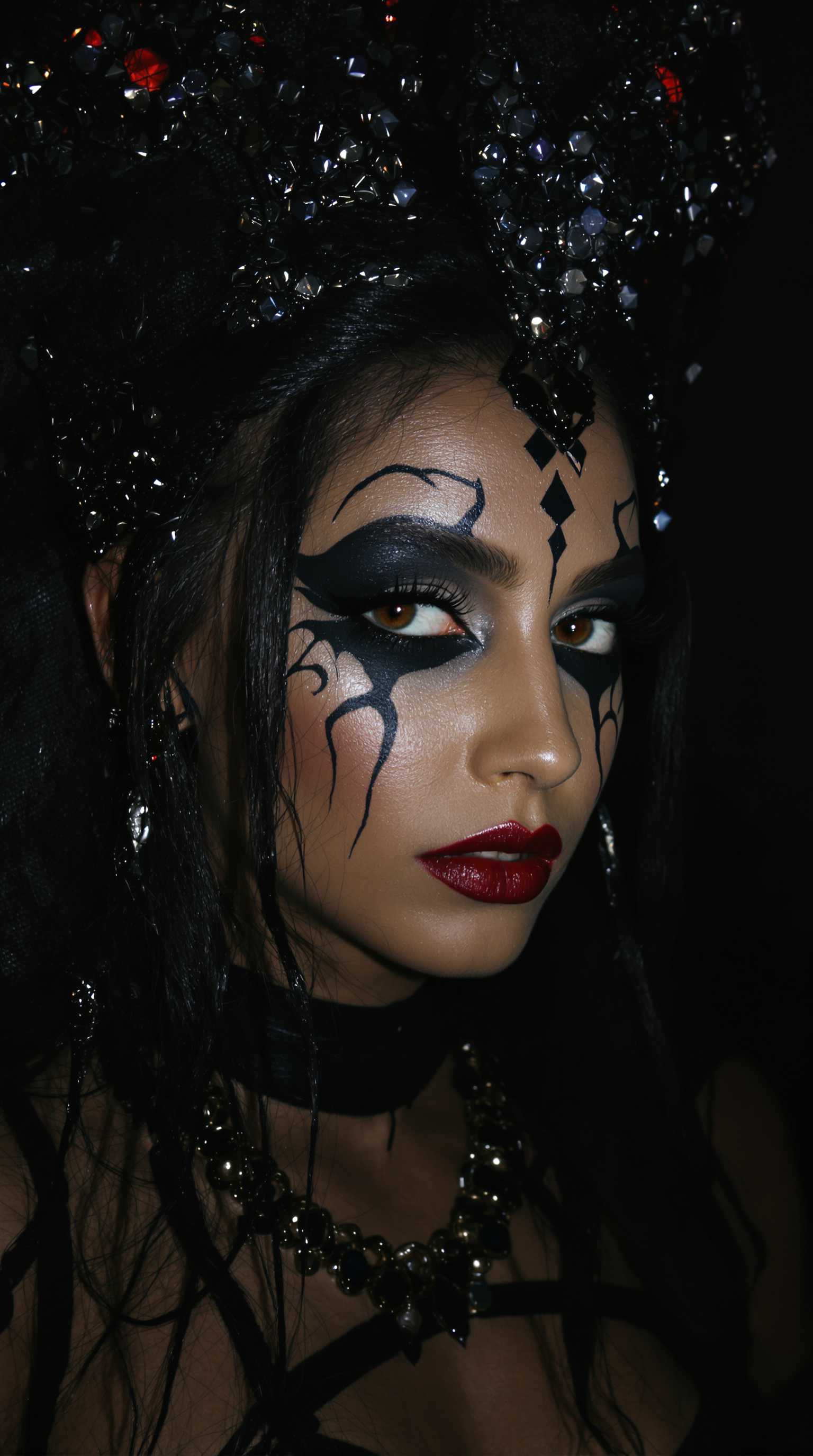 modeling photograph, rakshasa, indian  beautiful, dark, mysterious, goth makeup, detailed flawless face, dramatic darkroom lighting, high exposure, (bubbly background:0.7), head and shoulders, 80mm camera