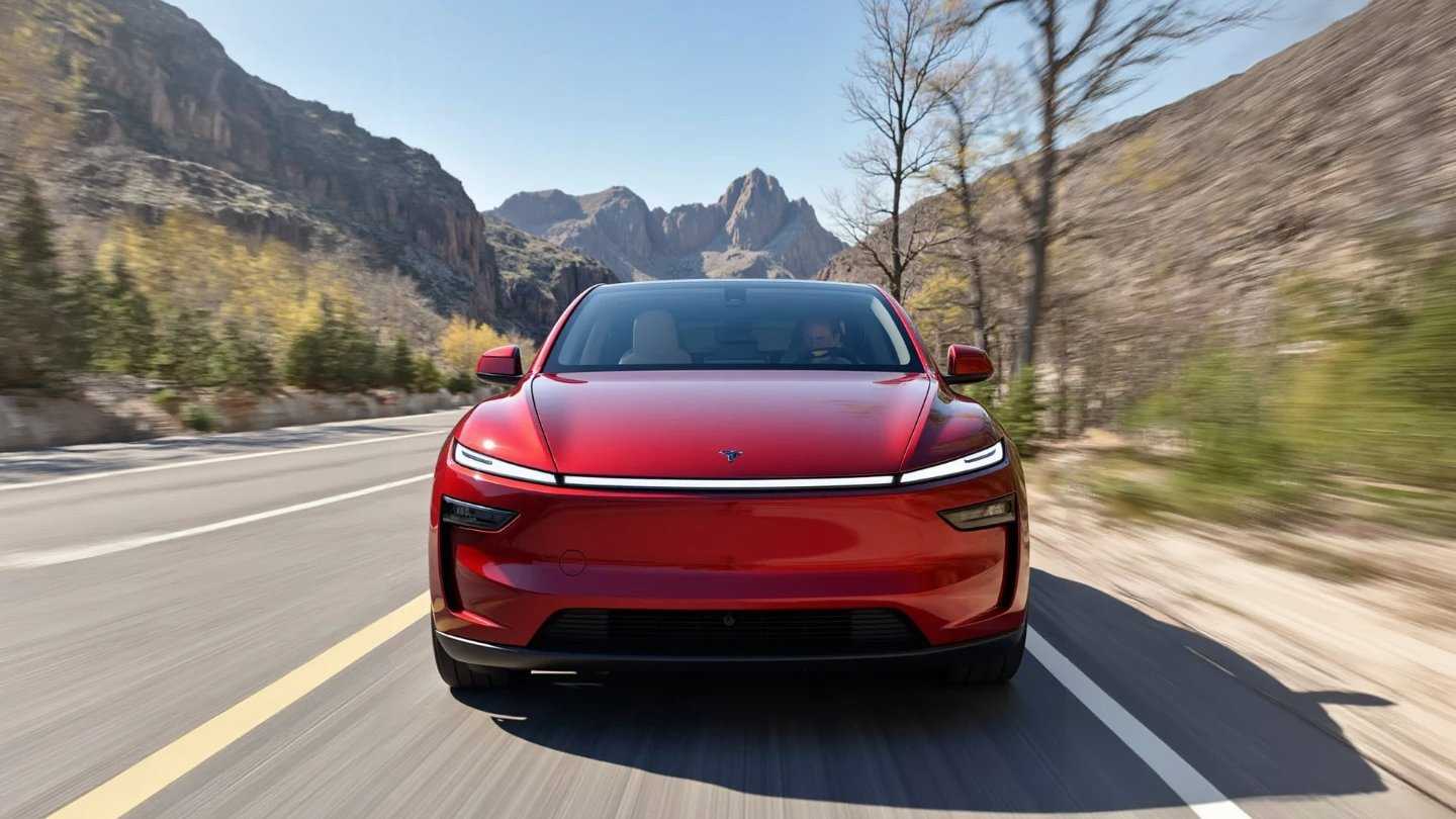 A car surrounded by mountains and vegetation