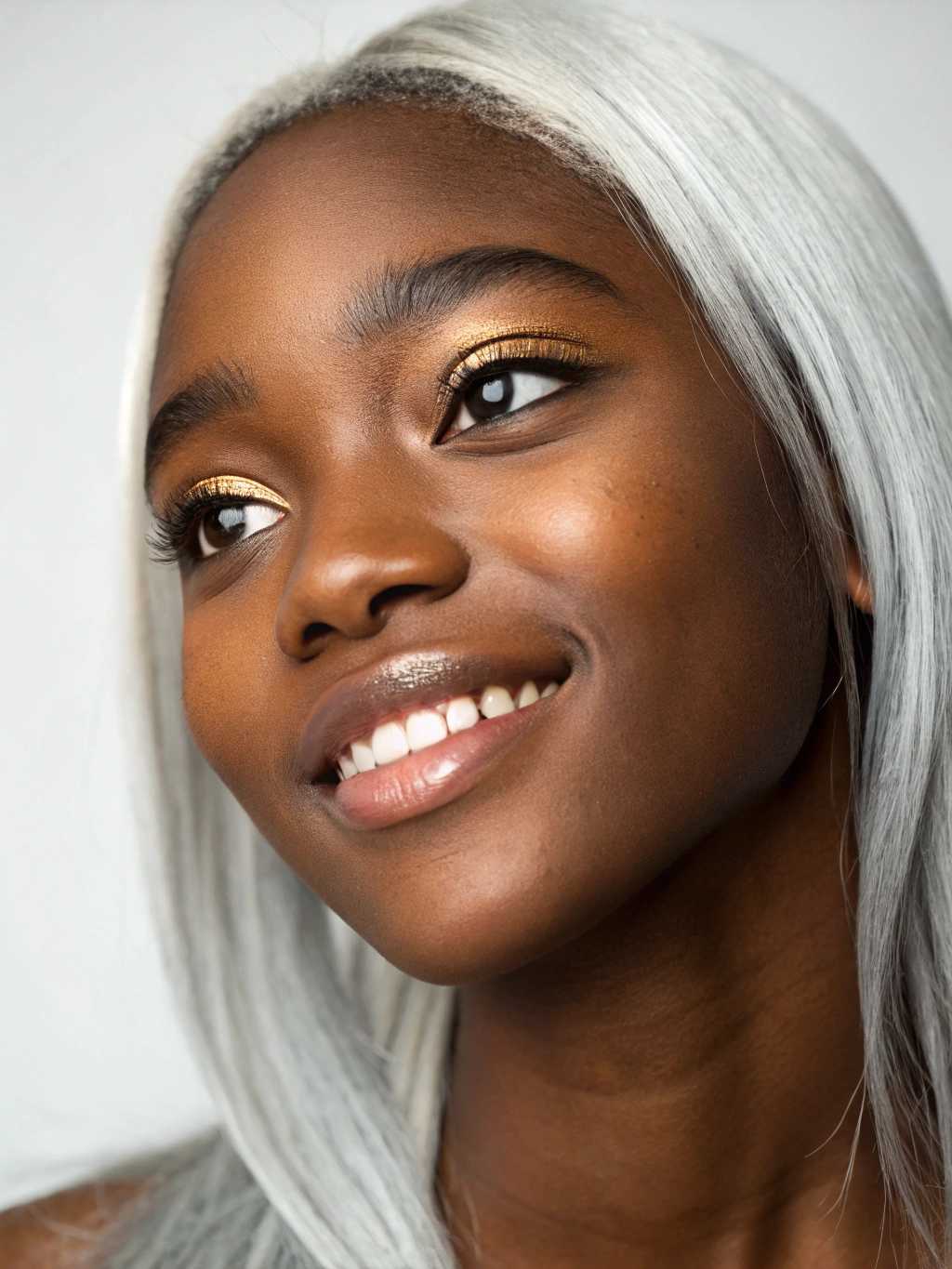 Hyper detailed, extremely detailed, UHD, 8k, 35mm, Canon EOS 5D, portrait of black female teenager, intrinsic detailed skin, bright clear eyes, straight silver hair, massive metallic makeup, silver and golden eye shadow, light mascara, slight smile, perfect teeth,