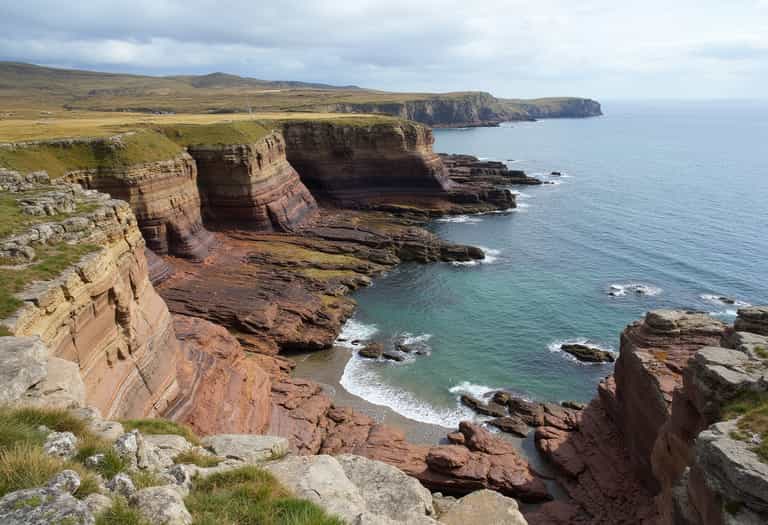 Dramatic Cliffs and Tranquil Sea
