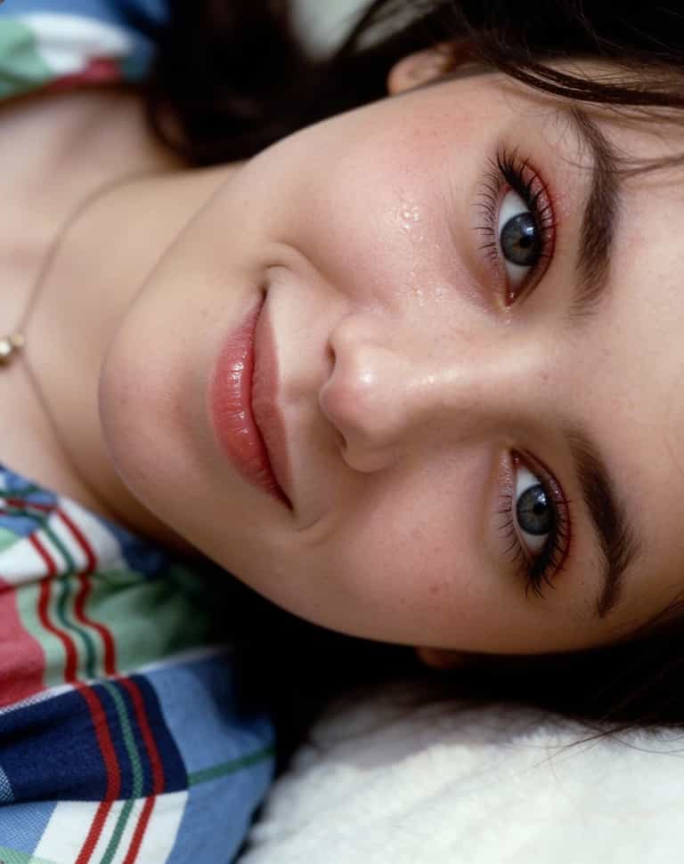 AI-generated image: (Core Subject:
A super-realistic photographic headshot of a woman,  lying on their side, head restin