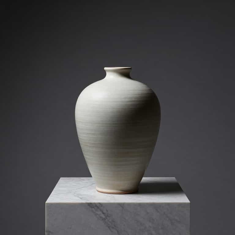 Pale Vessel on Marble Plinth