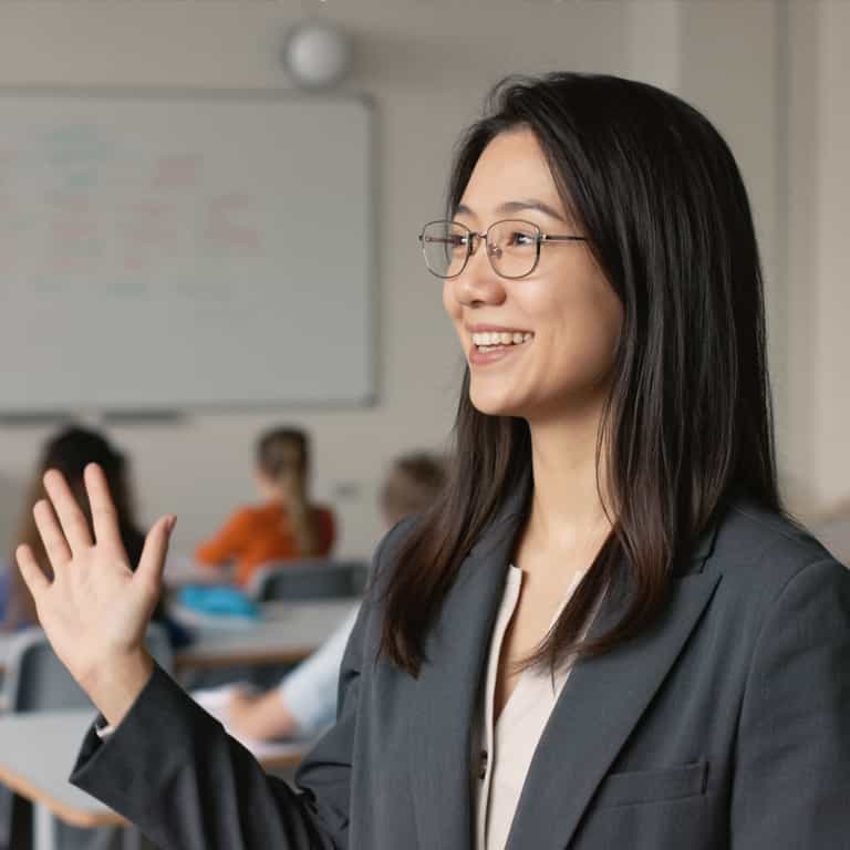 Engaging Educator in Sunlit Classroom