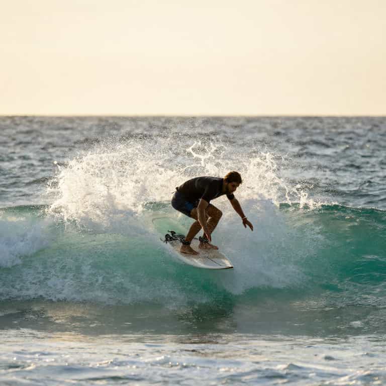 Surfer Carving Turquoise Wave