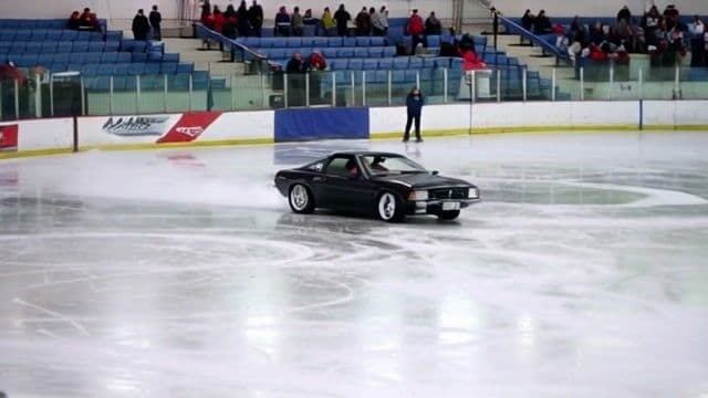 a car drifting around an ice rink