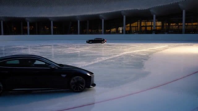 a car drifting around an ice rink