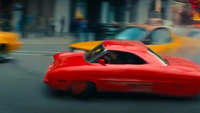 a car drifting through the busy streets of new york