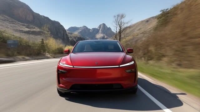 a car speeding down the highway