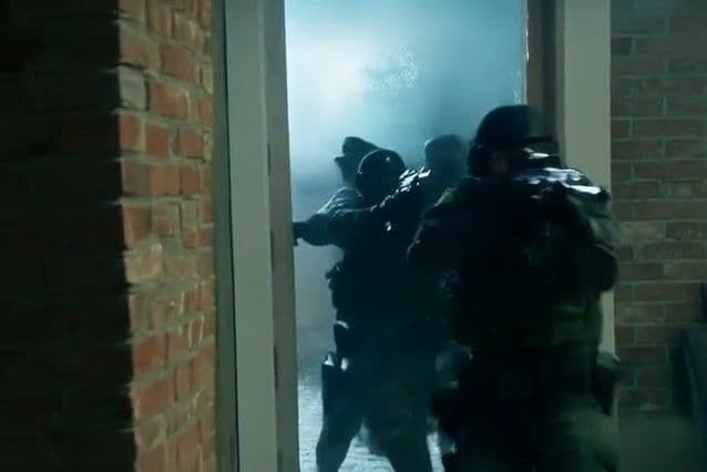 Marines breaking down the door, rushing into with heavy boots, and weapons clanging