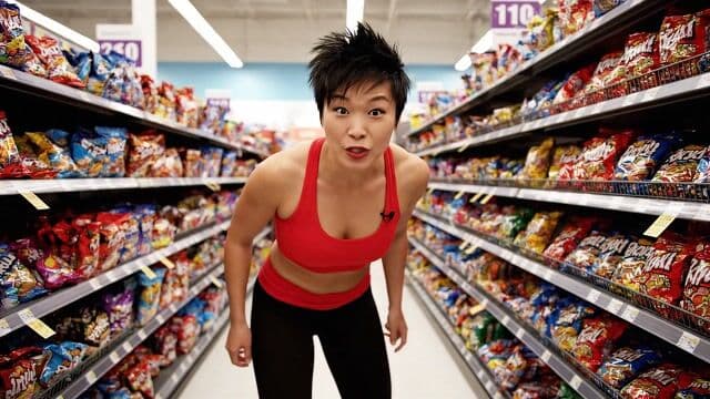 a thrilling action sequence of a woman trying to find her favorite candy. The candy wrapper is purple with a pixelated dragon and reads "Pixel Dojo". The woman says "Gotta have that pixel dojo candy. with over 60 ai tools, it's basically zero calories."