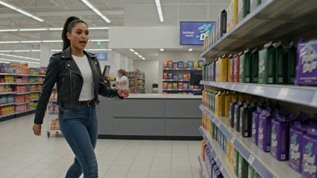 a thrilling action sequence of a woman trying to find her favorite candy. The candy wrapper is purple with a pixelated dragon and reads "Pixel Dojo". The woman says "Gotta have that pixel dojo candy. with over 60 ai tools, it's basically zero calories."