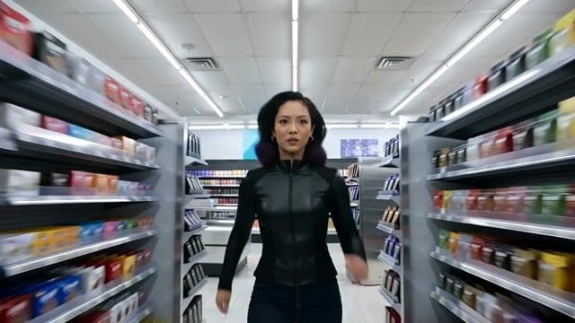 a thrilling action sequence of a woman trying to find her favorite candy. The candy wrapper is purple with a pixelated dragon and reads "Pixel Dojo". The woman says "Gotta have that pixel dojo candy. with over 60 ai tools, it's basically zero calories."