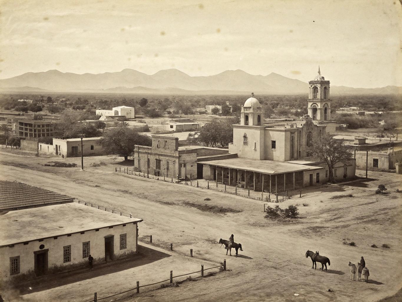 Create a photorealistic monochrome photo of an 1863 Tucson, Arizona, few horses, buildings drone view, photo is aged, worn edges.