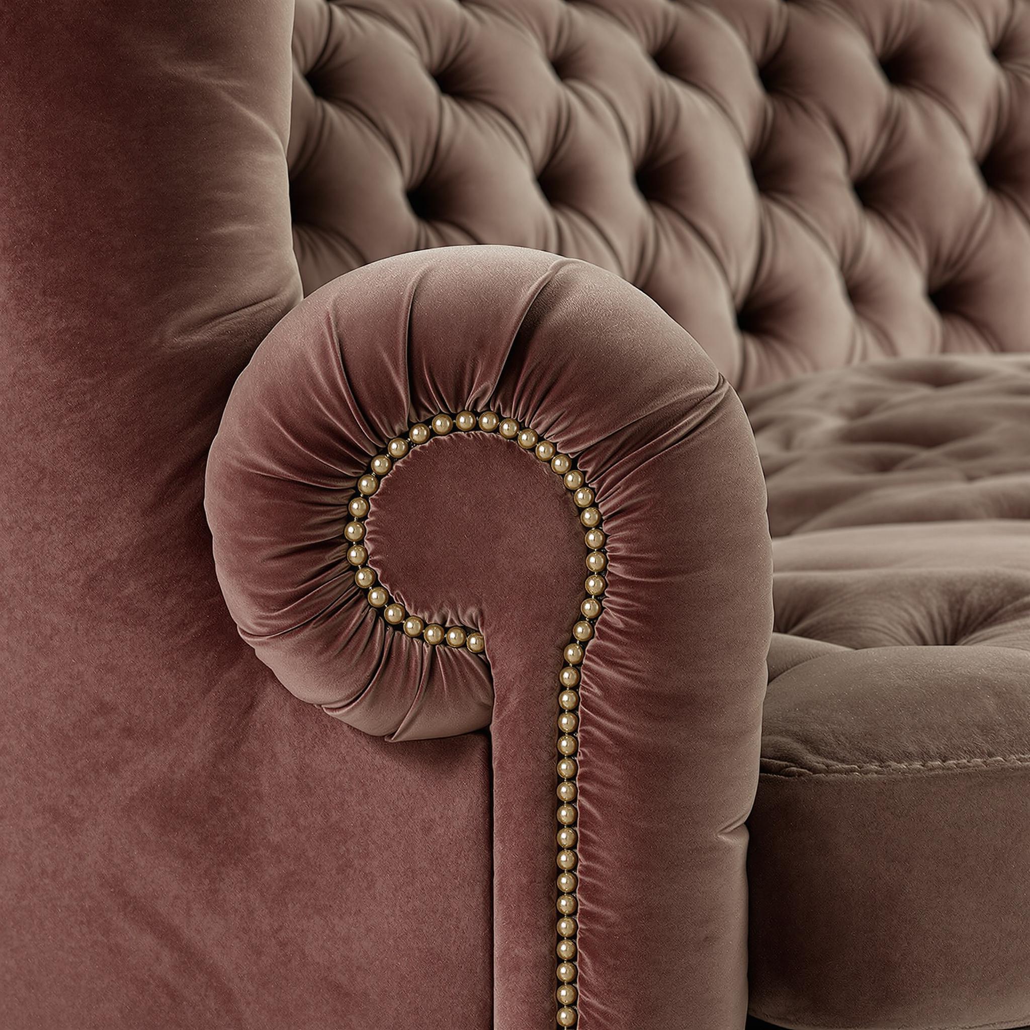 A plush velvet sofa with intricate stitching details
