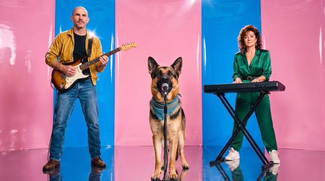 The band, a guitarist, a singing German Shepherd and a keyboardist, in the Y2K pop look