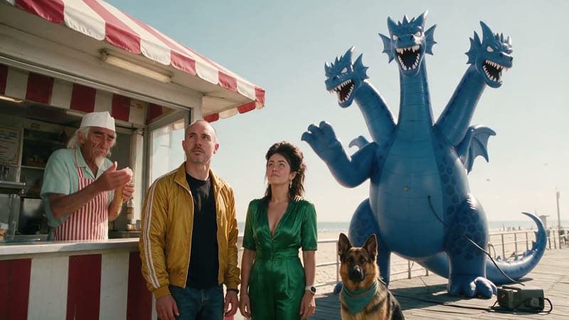 Gus, Brian, Pamela and Circe at a boardwalk ice cream stand, the three-headed inflatable dragon beside them