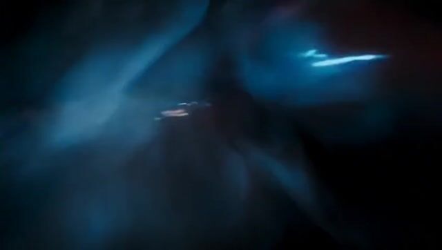 the ultra-wide-angle lens follows closely from the hood, with raindrops continuously splattering
against the lens. Ahead, a sports car speeds around a corner, its tires violently skidding against the wet road,
creating a mist of water. Neon lights refract in the rain, leaving colorful streaks on the car’s surface. The camera
swiftly shifts to the side of the car, capturing the wheels spinning at high speed, before finally moving to the rear