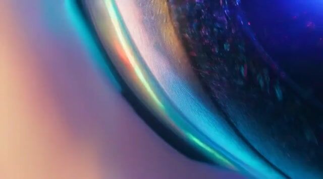 the ultra-wide-angle lens follows closely from the hood, with raindrops continuously splattering
against the lens. Ahead, a sports car speeds around a corner, its tires violently skidding against the wet road,
creating a mist of water. Neon lights refract in the rain, leaving colorful streaks on the car’s surface. The camera
swiftly shifts to the side of the car, capturing the wheels spinning at high speed, before finally moving to the rear