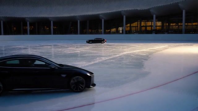 a car drifting around an ice rink