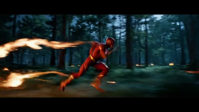 A hyper-speed superhero, resembling the flash, is sprinting through a dense, dark forest at night. The trees blur into streaks of green and black as he moves. Fiery trails burst behind him with every stride, igniting parts of the underbrush in glowing embers. As he weaves between the trees, the blazing trail he leaves behind slowly forms the words 'VEO 3 FAST @ Pixel Dojo' in glowing, molten fire on the forest floor. The camera zooms up to show the entire text.