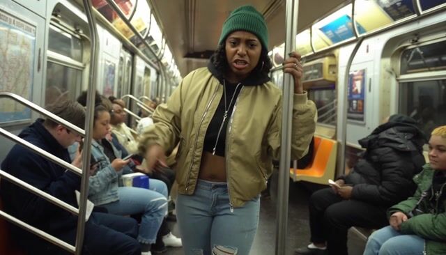 a woman rapping on the subway