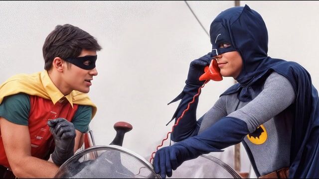 Batman calls catwoman for a date.