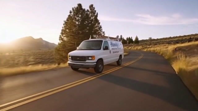 **Clip 7 (0:48-0:56):**
> **Prompt:** Street view. The "Handy's Handyman Service" van drives down a winding road toward the mansion. The sun glints off the windshield.
