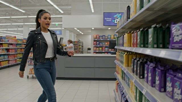 a thrilling action sequence of a woman trying to find her favorite candy. The candy wrapper is purple with a pixelated dragon and reads "Pixel Dojo". The woman says "Gotta have that pixel dojo candy. with over 60 ai tools, it's basically zero calories."