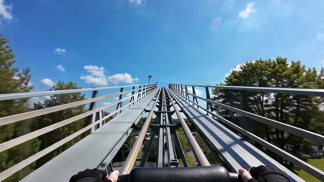 first-person roller coaster, one continuous shot, natural scene transitions.