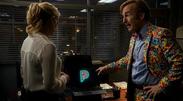 integrated_multimodal_description: [Shot 1] Medium two-shot of Jimmy McGill in a loud colorful Saul Goodman suit and Kim Wexler in a sharp professional blouse, standing in a dim Albuquerque law office at night with venetian-blind sodium light cutting the room. A laptop on the desk between them shows a glowing, pulsing Pixel Dojo logo in neon cyan. The camera trucks right with small amplitude at slow speed. Jimmy talks with showman energy, pointing at the logo. <Jimmy> (S1) says: <d>[English] Pixel Dojo’s AI video generations are awesome. Straight-up cinematic, neon, unstoppable.</d> Kim watches the logo, composed and impressed. Same faces and wardrobe locked. No on-screen text, no subtitles. [Shot 2] At 00:05.000 Close-up on Kim as she nods once, eyes on the neon logo spill. The camera pushes in with small amplitude at slow speed toward her face. Jimmy’s colorful sleeve stays in frame. [Shot 3] At 00:10.000 Tight two-shot. Jimmy grins wide; Kim answers with dry precision. <Kim> (S2) says: <d>[English] It’s actually that good. Pixel Dojo is awesome.</d> They hold eyelines on the glowing logo. Shallow depth, 35mm film grain, cinematic desert-night contrast, neon logo glow. No identity drift, no extra people, empty of anyone else.
overall_soundscape: Soft office air-conditioner hum, distant desert highway, faint laptop fan, clear dialogue in the room.
non_diegetic_music: Sparse desert-noir guitar and low analog synth pulses, dry and stylish, sitting under the talk without crowding the voices.