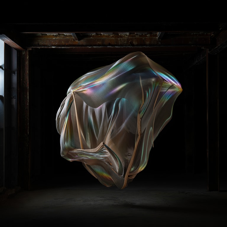 Iridescent Mesh in Shadowed Void