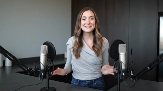 AI-generated image: A friendly female podcaster in a cool modern studio announcing that Pixel Dojo now has support for G
