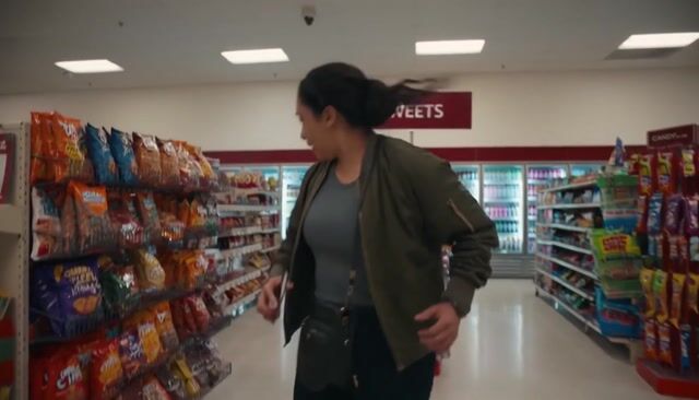 AI-generated image: a thrilling action sequence of a woman trying to find her favorite candy. The candy wrapper is purpl