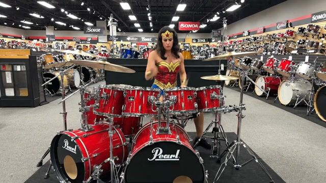 AI-generated image: Wonder Woman plays the drums in a Jazz Fusion style at a Music store.