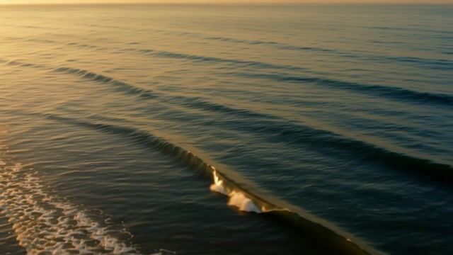 Waves Rolling in Golden Light