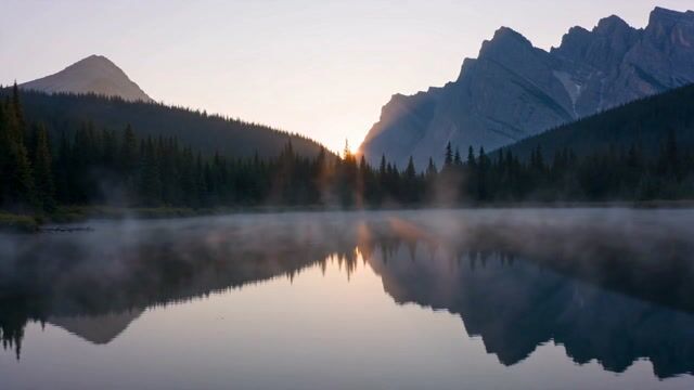 Mist Veiled Dawn Over Mountain Lake