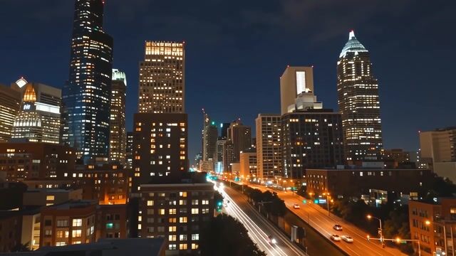 Glowing Towers Over Night Traffic