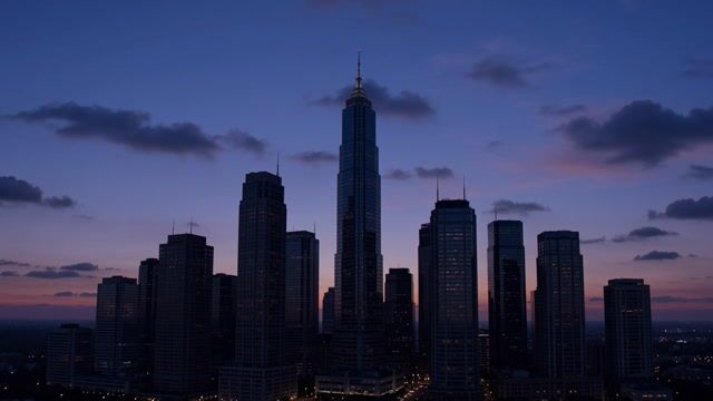 Twilight Spire Over Urban Towers