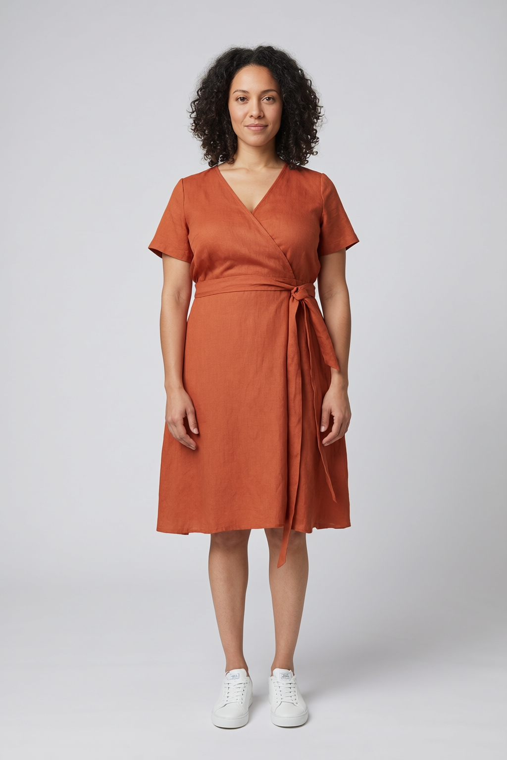 Qwen Image 2 Edit: the woman in the rust wrap dress in a slightly tighter, closer frame