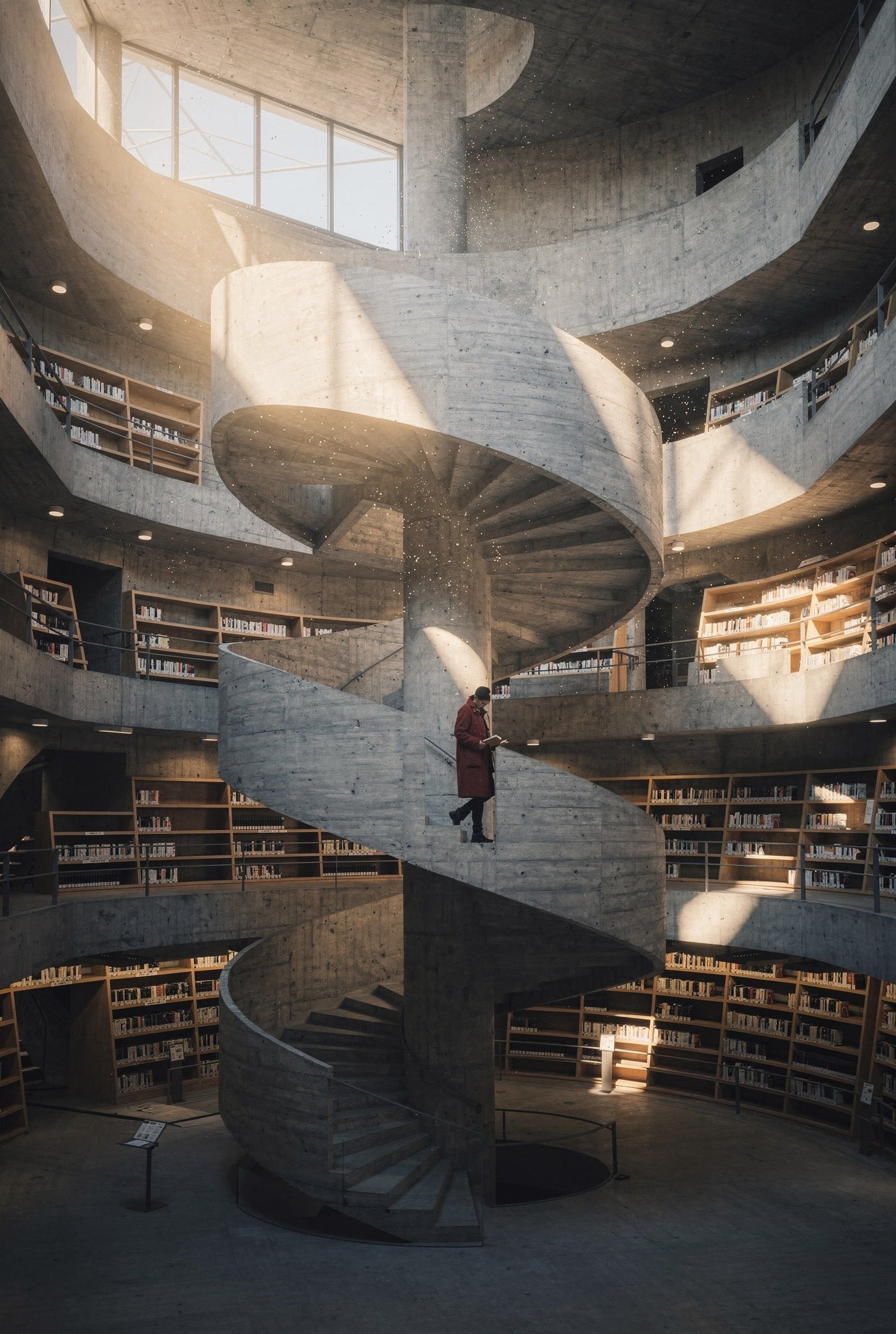 A board formed concrete spiral staircase winding up through a round five story library atrium, low gold sunlight cutting through a high window in shafts full of dust, a small figure in a red coat reading on the stairs, curved oak shelves on every level
