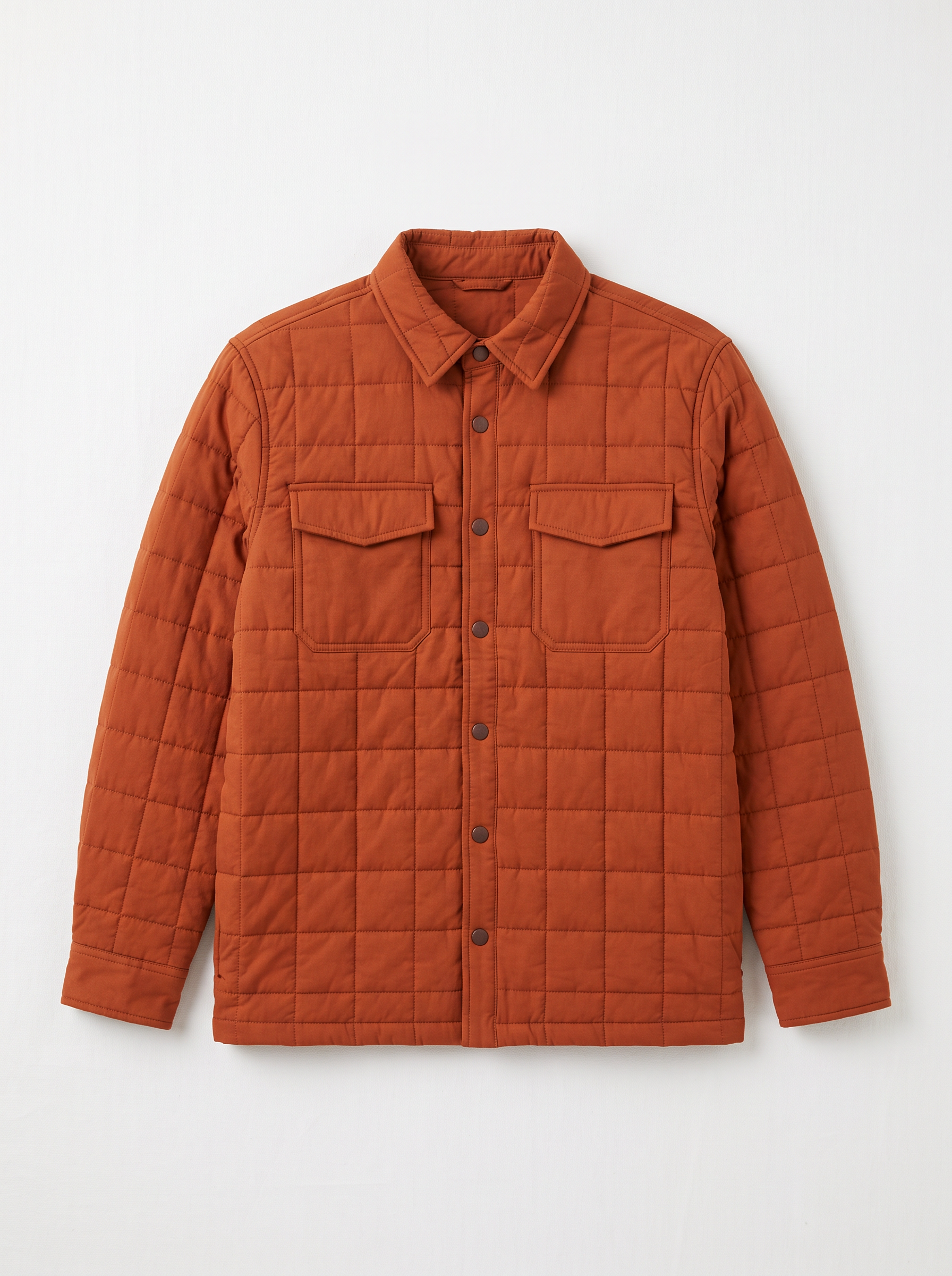 The product: a rust orange quilted overshirt with snap buttons and two chest pockets on white