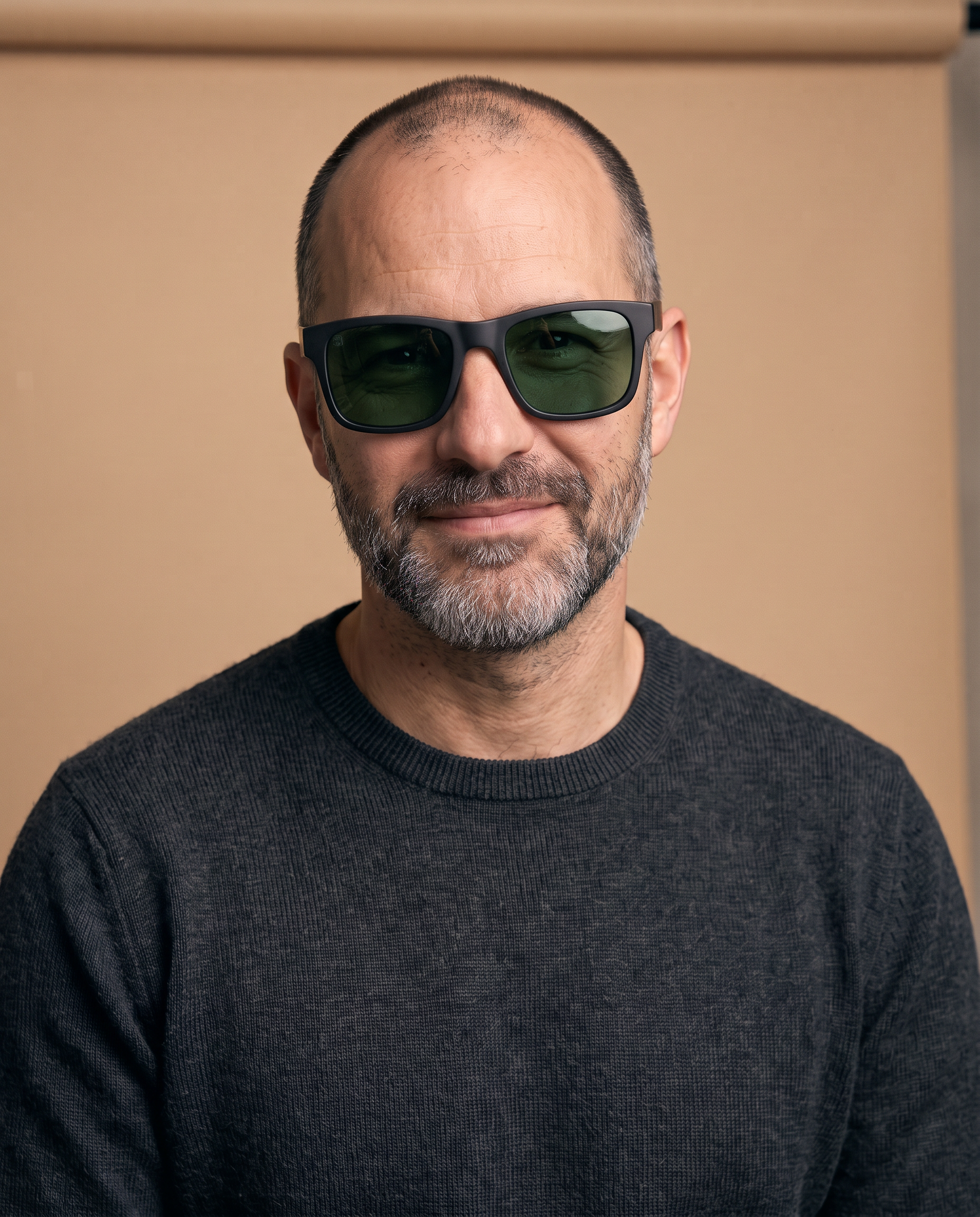 Step 3a, try on with Nano Banana 2.1: the same man wearing the matte black sunglasses on a beige backdrop