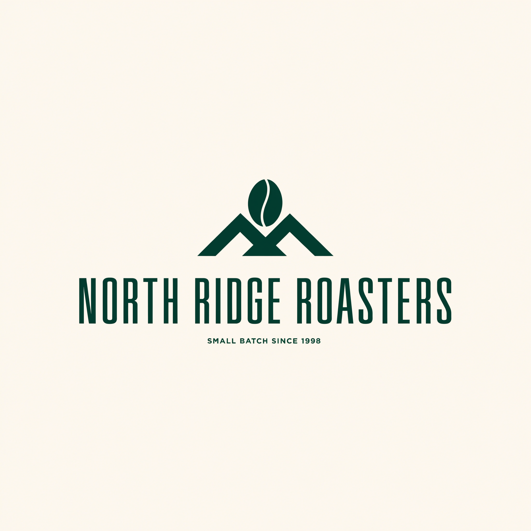 Logo for North Ridge Roasters: a dark green coffee bean resting on two angular mountain peaks above the condensed wordmark NORTH RIDGE ROASTERS and the line SMALL BATCH SINCE 1998 on a cream background