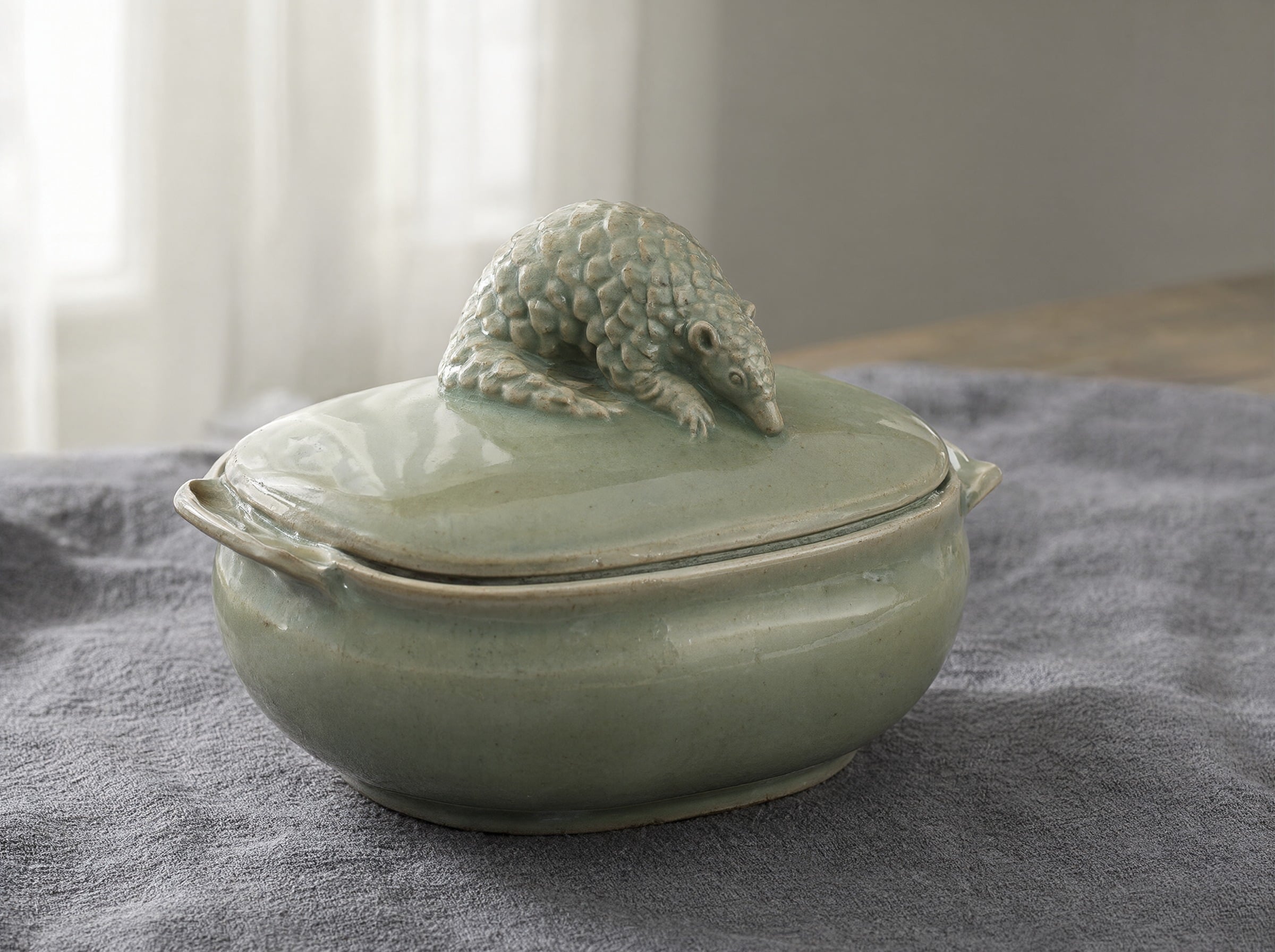 Qwen Image 2.1: a lidded celadon dish with a small pangolin perched on top as the handle